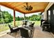Inviting outdoor patio area with seating, ceiling fan, grill, and a view of the backyard at 1284 N Letterman Rd, Paragon, IN 46166