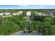 Scenic aerial view of a park and town square surrounded by lush greenery and historic buildings at 12874 Tradd St, Carmel, IN 46032