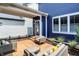 Relaxing backyard patio features modern outdoor furniture and a serene view of the neighborhood at 12874 Tradd St, Carmel, IN 46032