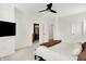 Spacious bedroom features a sleek ceiling fan, large windows, and an attached bathroom at 12874 Tradd St, Carmel, IN 46032