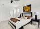 Well-lit bedroom with a comfortable bed, decorative art, and modern furnishings at 12874 Tradd St, Carmel, IN 46032