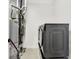 A functional laundry room offers modern appliances and essential utilities in a compact space at 12874 Tradd St, Carmel, IN 46032