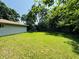 Large backyard featuring lush grass and a storage shed at 1345 S Biltmore Ave, Indianapolis, IN 46241