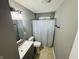 Bathroom with shower-tub combo, tile flooring, and vanity at 1345 S Biltmore Ave, Indianapolis, IN 46241