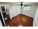 Bedroom featuring hardwood floors, a ceiling fan, and closet at 1345 S Biltmore Ave, Indianapolis, IN 46241