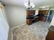 A well-lit kitchen featuring stone floors, dark wood cabinetry, and stainless steel appliances at 1345 S Biltmore Ave, Indianapolis, IN 46241
