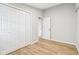 Bedroom with light grey walls and light-toned wood flooring at 1648 Ringgold Ave, Indianapolis, IN 46203