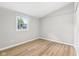 Bedroom featuring light grey walls and light-toned wood flooring at 1648 Ringgold Ave, Indianapolis, IN 46203