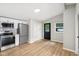 Bright kitchen with modern appliances, gray backsplash, and ample counter space at 1648 Ringgold Ave, Indianapolis, IN 46203