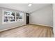 Bright living room featuring new wood floors, freshly painted walls, and a large window at 1648 Ringgold Ave, Indianapolis, IN 46203
