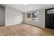 Inviting living room with new wood floors, fresh paint, and natural light from a large window at 1648 Ringgold Ave, Indianapolis, IN 46203