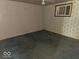 Bedroom with faded wallpaper, worn carpeting, and basic window showing a space needing updates at 1816 E Highland Ave, Muncie, IN 47303