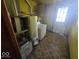Utility room with washer, water heater, furnace, and storage cabinets at 1816 E Highland Ave, Muncie, IN 47303