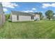 Expansive backyard featuring a lush green lawn, perfect for outdoor activities at 1912 Blue Pine Ln, Indianapolis, IN 46231