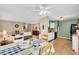 Open-concept dining area with modern lighting and seamless flow to the kitchen and living spaces, ideal for entertaining at 1912 Blue Pine Ln, Indianapolis, IN 46231