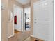 Hallway featuring neutral walls and carpeting, and white doors leading to other rooms in the home at 1912 Blue Pine Ln, Indianapolis, IN 46231