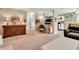 Inviting living area featuring carpet flooring, comfortable furnishings and ample space, creating a warm and welcoming atmosphere at 1912 Blue Pine Ln, Indianapolis, IN 46231