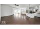 Open concept living space with hardwood floors, lots of windows, and a modern kitchen at 19995 Gansett Rd, Westfield, IN 46074