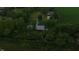 Spacious property featuring lush trees, green grass, outbuilding and charming home at 2000 Hawthorne Dr, Plainfield, IN 46168