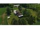 Aerial view featuring home, cornfield, barn, and well-maintained lawn at 2000 Hawthorne Dr, Plainfield, IN 46168