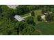 Aerial view of the barn with surrounding trees, greenery, and cornfield at 2000 Hawthorne Dr, Plainfield, IN 46168
