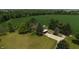 Aerial view of a stunning property featuring a manicured lawn, mature trees, and beautiful landscaping at 2000 Hawthorne Dr, Plainfield, IN 46168