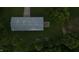 An aerial view of the outbuilding with gray roof, surrounded by green grass and lush trees at 2000 Hawthorne Dr, Plainfield, IN 46168