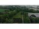 An aerial view of property showcasing expansive green space, trees, and a building at 2000 Hawthorne Dr, Plainfield, IN 46168