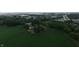 The view of the home and outbuildings from the air, plus a field at 2000 Hawthorne Dr, Plainfield, IN 46168