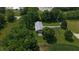 Aerial shot of barn with silver roof, green lawn, and vegetable garden at 2000 Hawthorne Dr, Plainfield, IN 46168