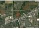 Aerial view of property outlined in red showing home and surrounding land with road and neighborhood at 2000 Hawthorne Dr, Plainfield, IN 46168