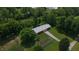 Aerial image of barn, lush trees, well-kept garden, and expansive lawn at 2000 Hawthorne Dr, Plainfield, IN 46168