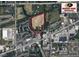 Aerial view of property outlined in red showing home and surrounding land with road and neighborhood at 2000 Hawthorne Dr, Plainfield, IN 46168
