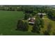 Expansive aerial view of home, cornfield, barn, and lush trees at 2000 Hawthorne Dr, Plainfield, IN 46168
