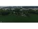 Aerial view of property with large field and a building in wooded and quiet area at 2000 Hawthorne Dr, Plainfield, IN 46168