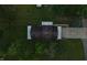 An aerial view of a single-Gathering home with a dark roof, gray patio and lots of green grass at 2000 Hawthorne Dr, Plainfield, IN 46168