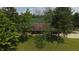 Aerial view of a beautiful home surrounded by lush greenery and mature trees in a tranquil setting at 2000 Hawthorne Dr, Plainfield, IN 46168