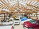 Spacious barn interior with high ceilings, exposed beams, and ample room for vehicle and equipment storage at 2000 Hawthorne Dr, Plainfield, IN 46168