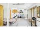 Finished basement with laundry facilities, exercise equipment, and ample lighting, perfect for a functional space at 2000 Hawthorne Dr, Plainfield, IN 46168
