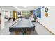 Finished basement with a pool table, seating area, and workout equipment, perfect for recreation at 2000 Hawthorne Dr, Plainfield, IN 46168