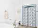 Clean bathroom with white fixtures, a floral shower curtain, and neutral decor at 2000 Hawthorne Dr, Plainfield, IN 46168