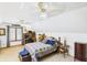 Charming bedroom with a cozy bed, workspace desk, and bright natural light from the window at 2000 Hawthorne Dr, Plainfield, IN 46168