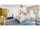 Cozy bedroom featuring a comfortable bed, natural light, and a traditional ceiling fan at 2000 Hawthorne Dr, Plainfield, IN 46168