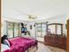 Comfortable bedroom with dual windows providing natural light, dresser and cozy decor at 2000 Hawthorne Dr, Plainfield, IN 46168