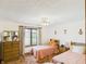 Bedroom featuring twin beds, natural lighting from the window, and a cozy setting at 2000 Hawthorne Dr, Plainfield, IN 46168