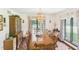 Formal dining room featuring a long wooden table, elegant chandelier, and built-in china cabinet at 2000 Hawthorne Dr, Plainfield, IN 46168