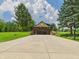 View of attractive home with stone accents and a basketball court to the side at 2000 Hawthorne Dr, Plainfield, IN 46168
