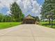 View of attractive home with stone accents and a basketball court to the side at 2000 Hawthorne Dr, Plainfield, IN 46168