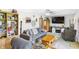 Spacious living room with a large couch, TV, and bookshelf, perfect for relaxation and entertainment at 2000 Hawthorne Dr, Plainfield, IN 46168