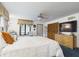 Bright main bedroom with a comfortable bed, dresser, and a window with natural light at 2000 Hawthorne Dr, Plainfield, IN 46168